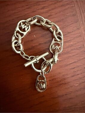 Michael Kors Gold Tone MK Logo Toggle Charm Bracelet